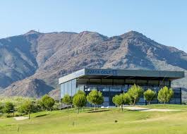 Azata Golf clubhouse with mountain backdrop